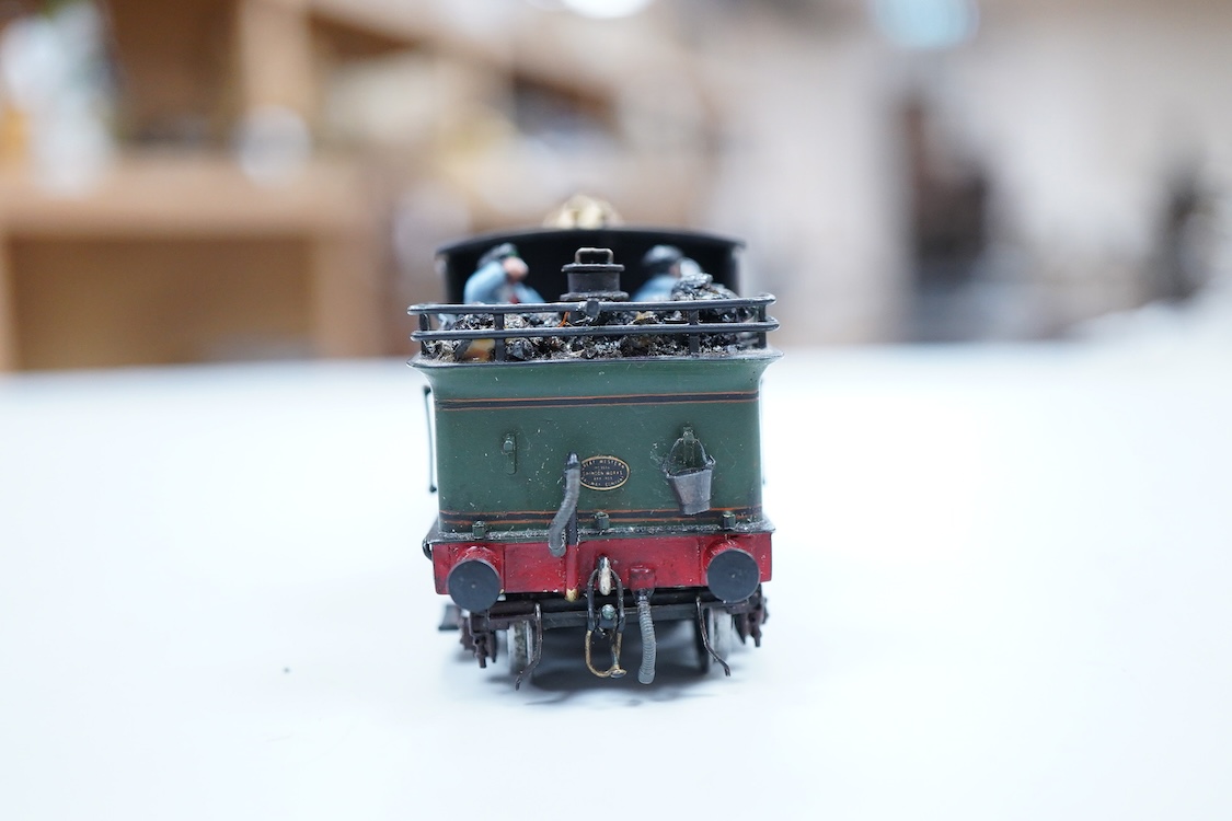 A narrow gauge scratch built model railway locomotive running on 32mm track by John Worsley, a Ruston 0-4-0 diesel shunter, 7, a detailed model with sprung buffers, etc. and fitted with a Mashima 12v dc motor, for two ra
